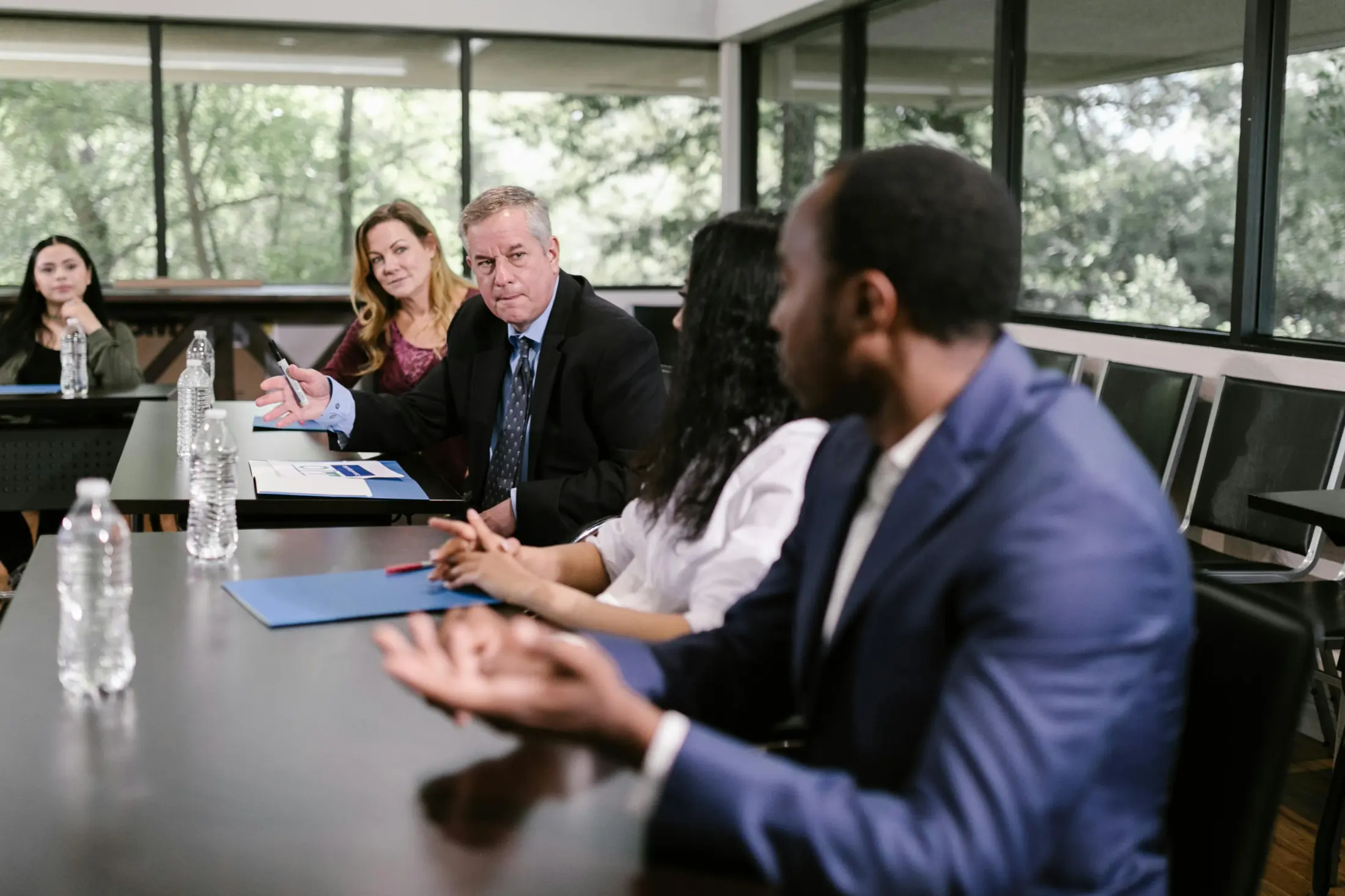 Team reviewing information security policy framework documents